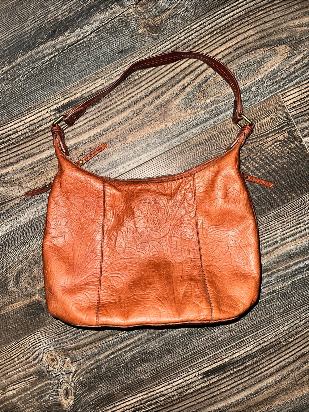American Leather Co. Hobo bag in cognac with an embossed floral print